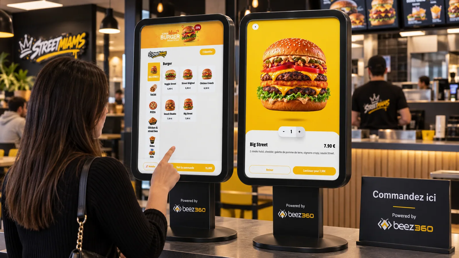 Commande sur les bornes BeezKiosk dans un fast-food, avec le marquage Beez360 sur les supports.